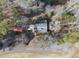 Aerial view of a home with a patio, landscaped yard, and driveway at 4041 Wendy Ln, Zebulon, NC 27597