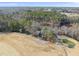 Aerial view of a home situated by a pond and a golf course at 4041 Wendy Ln, Zebulon, NC 27597