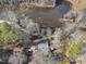 Aerial view of a home surrounded by lush trees and a scenic marsh at 4041 Wendy Ln, Zebulon, NC 27597