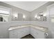 Bright bathroom with dual sinks, ample countertop space, and white cabinetry at 4041 Wendy Ln, Zebulon, NC 27597