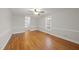 Bright bedroom with hardwood floors, neutral walls, and a ceiling fan at 4041 Wendy Ln, Zebulon, NC 27597