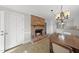 Charming dining room with view into the kitchen and an eye-catching brick fireplace at 4041 Wendy Ln, Zebulon, NC 27597