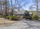 Charming home with a well-maintained front yard, mature trees, and a cozy screened-in porch at 4041 Wendy Ln, Zebulon, NC 27597