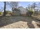 Rustic two-story home features a screened porch and a well-maintained natural landscape at 4041 Wendy Ln, Zebulon, NC 27597