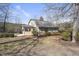 Inviting home with a beautiful outdoor patio area surrounded by lush landscaping at 4041 Wendy Ln, Zebulon, NC 27597