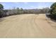 Expansive golf course view with well-maintained fairway and surrounding trees at 4041 Wendy Ln, Zebulon, NC 27597
