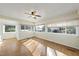 Bright sunroom with wood flooring, a ceiling fan, and lots of natural light at 4041 Wendy Ln, Zebulon, NC 27597