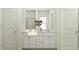 Clean bathroom featuring a dual sink vanity, a large mirror, and modern fixtures at 406 Queenstown Drive # 24, Kenly, NC 27542