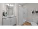 Bright bathroom featuring a granite countertop, shower, and neutral color palette at 412 N Green St, Selma, NC 27576