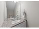 Bathroom featuring granite vanity top, faucet, sink, and towel rack at 412 N Green St, Selma, NC 27576