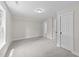 Upstairs bedroom with neutral colored carpet and bright white trim at 412 N Green St, Selma, NC 27576