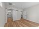 Bedroom has wood-look floors, sliding barn door to bathroom, and is adjacent to another room at 412 N Green St, Selma, NC 27576