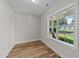 Cozy bedroom featuring a large window with a view of the exterior yard at 412 N Green St, Selma, NC 27576