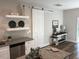 Charming kitchen with granite countertops, stainless steel appliances and a decorative sliding door at 412 N Green St, Selma, NC 27576