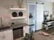 Charming kitchen with granite countertops, stainless steel appliances and a decorative sliding door at 412 N Green St, Selma, NC 27576