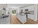 Modern kitchen featuring stainless steel appliances, white cabinets, and center island at 412 N Green St, Selma, NC 27576