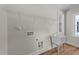 Laundry room sink with wall-mounted wire racks for added storage at 412 N Green St, Selma, NC 27576