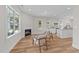 Bright living room featuring a fireplace and seating, opens to the kitchen area at 412 N Green St, Selma, NC 27576
