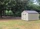 Well built shed with a metal roof and double doors on a grassy lot at 412 N Green St, Selma, NC 27576