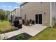 Cozy back patio with outdoor seating, grill, and landscaped garden beds at 434 Golden Villas Dr, Rocky Mount, NC 27809