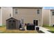 Exterior backyard of house with shed and patio, perfect for entertaining or relaxing at 434 Golden Villas Dr, Rocky Mount, NC 27809