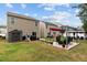 Spacious backyard featuring patios and manicured garden beds, perfect for outdoor entertaining at 434 Golden Villas Dr, Rocky Mount, NC 27809