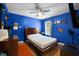 Cozy bedroom featuring modern fixtures, a large bed, and ample storage for personal belongings at 434 Golden Villas Dr, Rocky Mount, NC 27809
