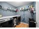 Efficient laundry room with shelving, storage, and modern washer and dryer units at 434 Golden Villas Dr, Rocky Mount, NC 27809