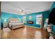 Main bedroom with laminate wood flooring, bed, and a modern electric fireplace at 434 Golden Villas Dr, Rocky Mount, NC 27809