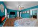 Spacious main bedroom featuring a ceiling fan, TV, and ensuite bathroom for added convenience at 434 Golden Villas Dr, Rocky Mount, NC 27809