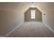 Unfinished attic space with natural light from window at 45 Trescott St, Smithfield, NC 27577