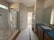 Modern bathroom featuring separate shower with glass doors, toilet and vanity at 45 Trescott St, Smithfield, NC 27577