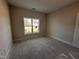 Bright bedroom with natural light from a large window at 45 Trescott St, Smithfield, NC 27577