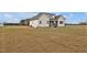 Exterior view of home featuring a screened in back porch and large backyard at 4840 Baines Loop Rd, Spring Hope, NC 27882