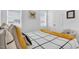 Well-lit bedroom with large windows, a comfortable bed, and decor with yellow accents at 4840 Baines Loop Rd, Spring Hope, NC 27882
