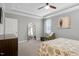 A spacious bedroom features a tray ceiling, an decorative mirror, and a comfortable bed with decorative pillows at 4840 Baines Loop Rd, Spring Hope, NC 27882