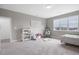 Spacious bedroom with a large window, plush carpet and space for storage at 4840 Baines Loop Rd, Spring Hope, NC 27882