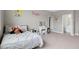 Bright bedroom with a vanity, plush carpet and a comfortable bed at 4840 Baines Loop Rd, Spring Hope, NC 27882