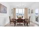 This dining room features natural light, modern light fixture, and wainscoting at 4840 Baines Loop Rd, Spring Hope, NC 27882