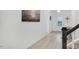 Light-filled foyer featuring hardwood floors and staircase, leading to other rooms at 4840 Baines Loop Rd, Spring Hope, NC 27882