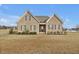 Charming brick home with a well-maintained front lawn and classic architectural details at 4840 Baines Loop Rd, Spring Hope, NC 27882