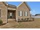 Inviting front porch with a classic brick facade and decorative shutters on the windows at 4840 Baines Loop Rd, Spring Hope, NC 27882