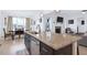 This kitchen island features granite countertops, stainless appliances, and dark cabinetry at 4840 Baines Loop Rd, Spring Hope, NC 27882