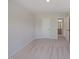 Spacious bedroom with open door to the en-suite bathroom at 5005 Shipper Ln, Durham, NC 27703