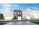 A row of charming townhomes showcases varied architectural styles and colors at 5005 Shipper Ln, Durham, NC 27703