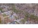 Stunning aerial view of a neighborhood nestled among green trees and snow-dusted grounds at 659 Willard Dr, Creedmoor, NC 27522
