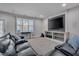 Finished basement featuring a theater setup with a large screen and comfortable seating at 659 Willard Dr, Creedmoor, NC 27522