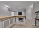 Basement bar featuring a wood countertop, built in microwave, and modern fixtures at 659 Willard Dr, Creedmoor, NC 27522