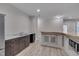 Basement kitchen with wood-look flooring, granite countertop, and stainless steel appliances at 659 Willard Dr, Creedmoor, NC 27522