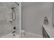 Tiled bathroom with vanity, modern fixtures, and a shower-tub combination at 659 Willard Dr, Creedmoor, NC 27522